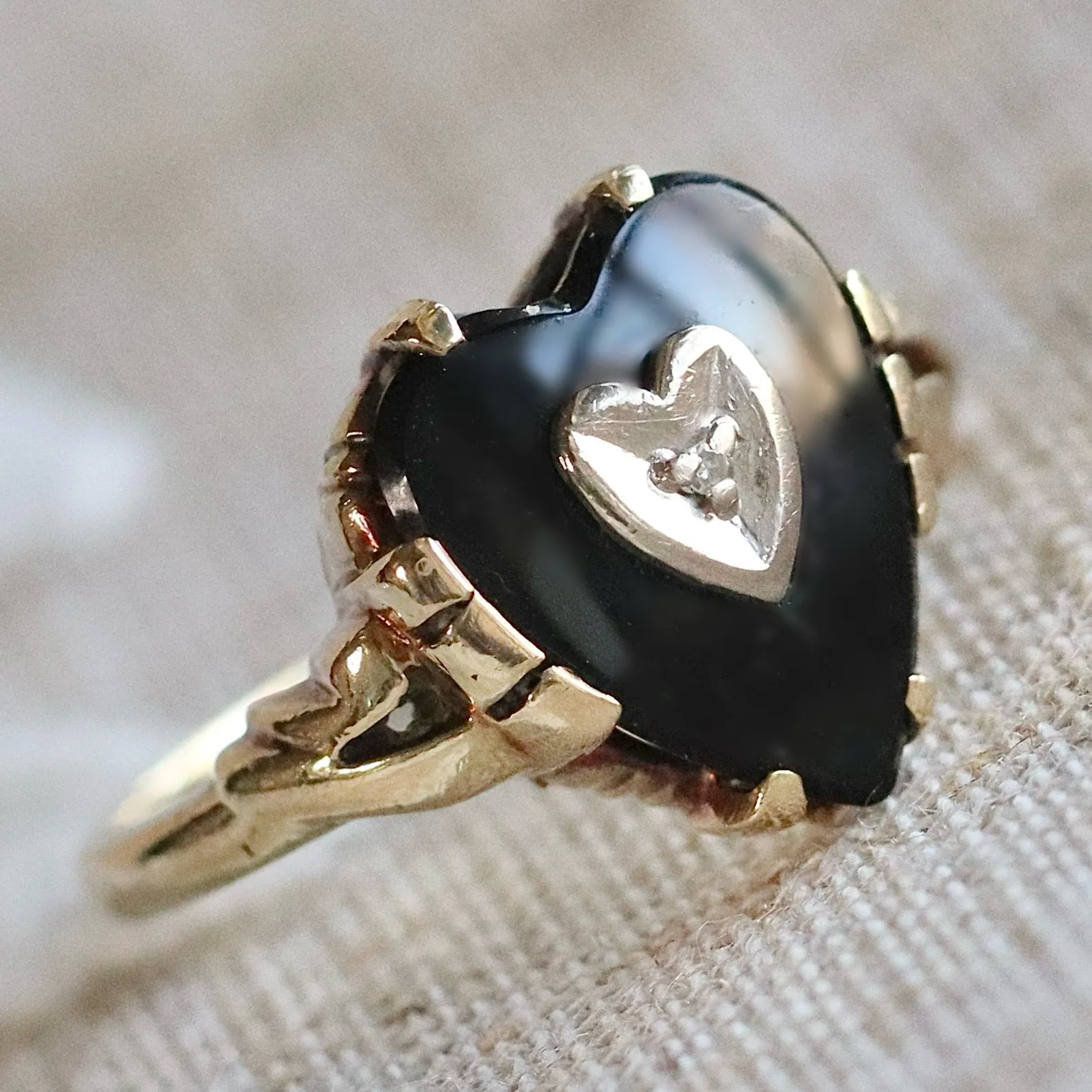 Heart shaped onyx and diamond ring in yellow gold