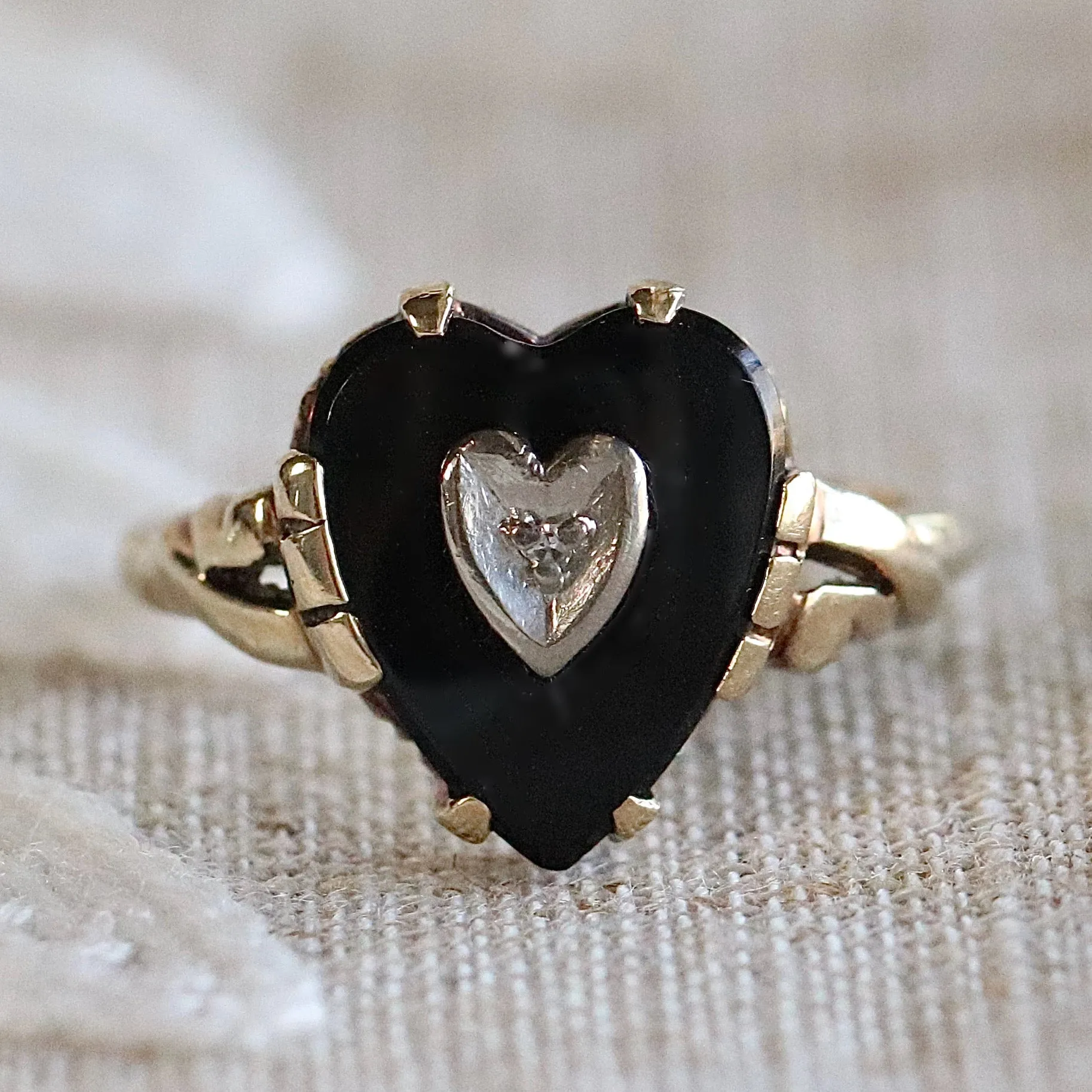 Heart shaped onyx and diamond ring in yellow gold