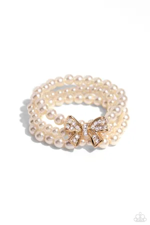 How Do You Do? - Gold - White Rhinestone Bow and Pearl Paparazzi Stretchy Bracelet