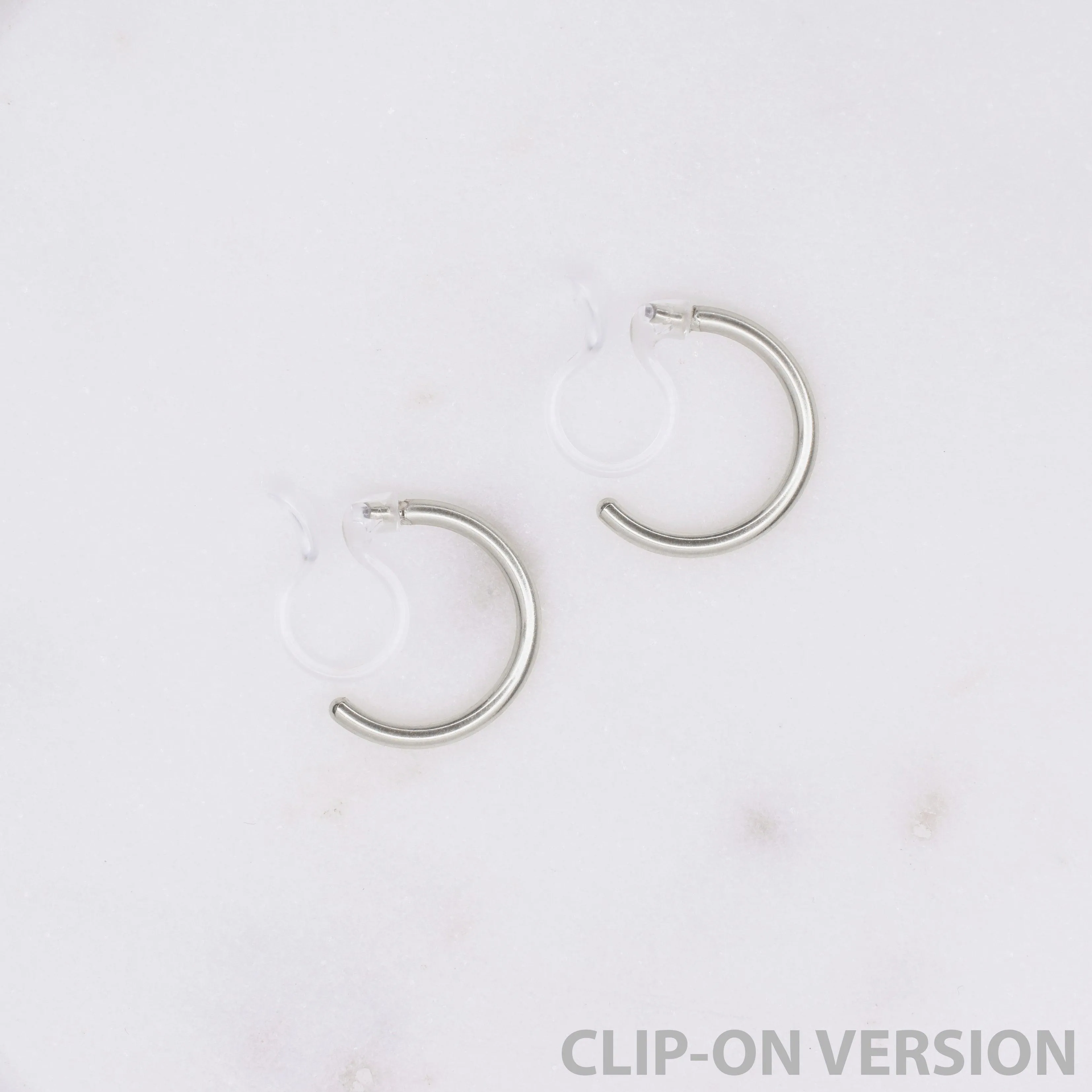 HUGGIE HOOP CLIP-ON EARRINGS IN SILVER